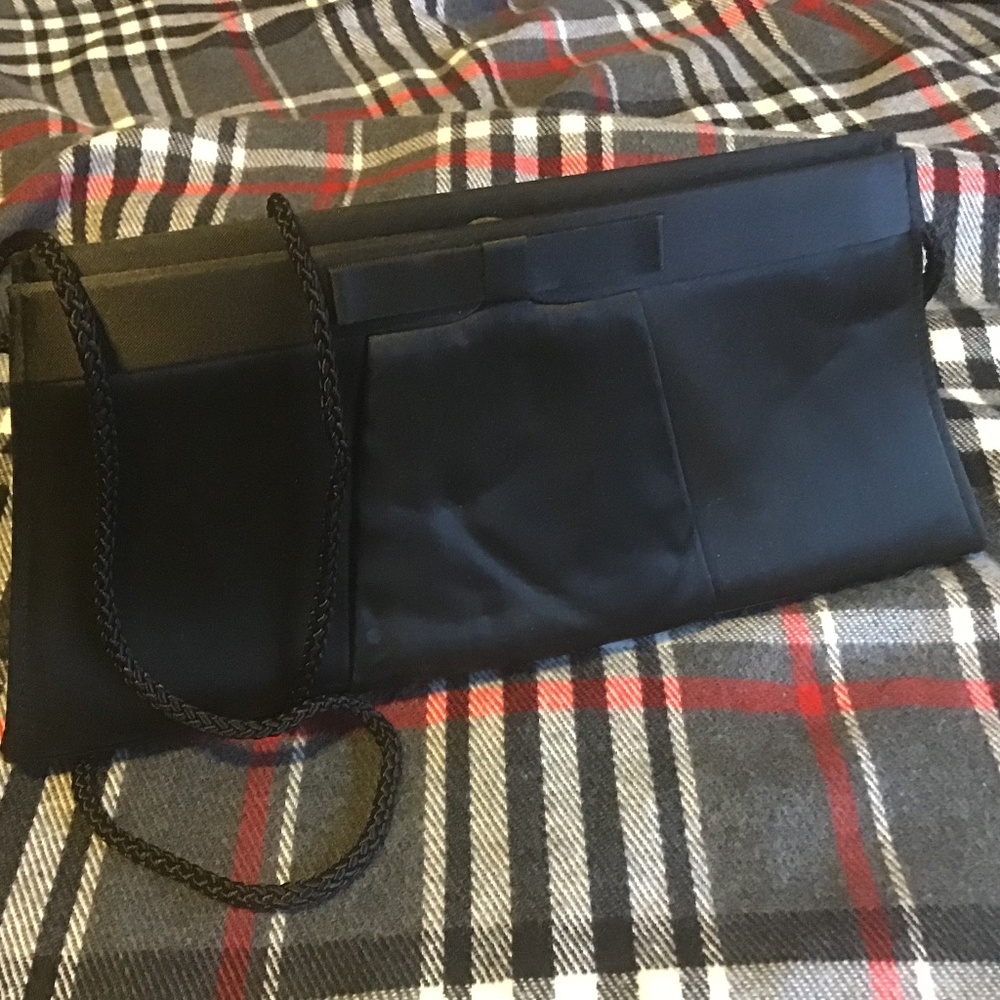 Shoulder or clutch black silky bag..